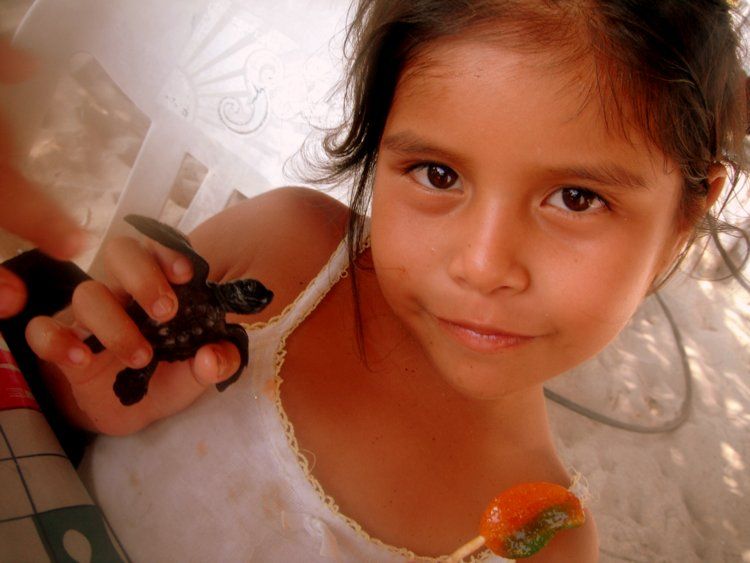 Zipolite girl with baby turtle