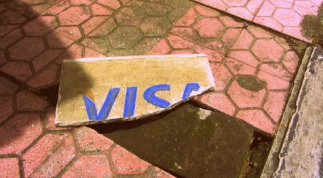 Broken Visa sign consumerism in America